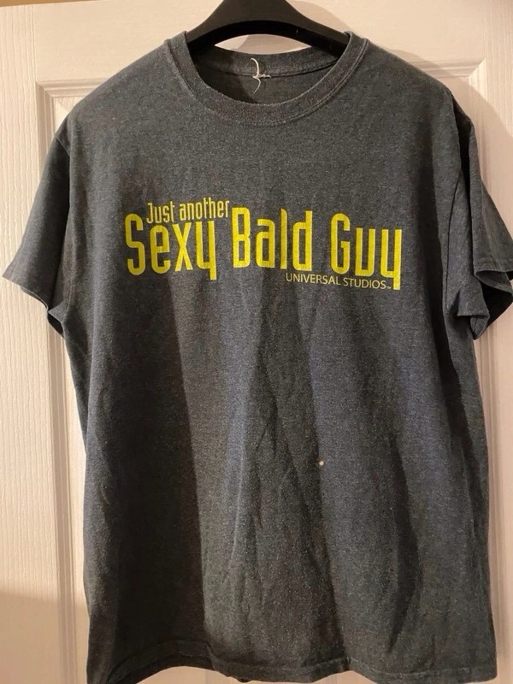 Universal Charcoal Short Sleeve Tee with Yellow 'Sexy Bald Guy' Graphic